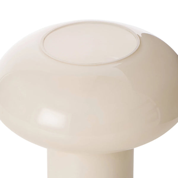 Close-up of a beige mushroom-shaped lamp on a white background