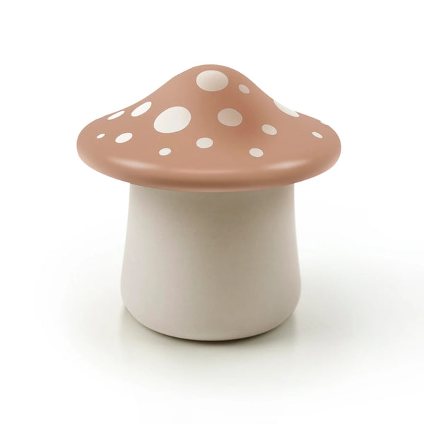 Mushroom-shaped container with a polka dot cap on a white background