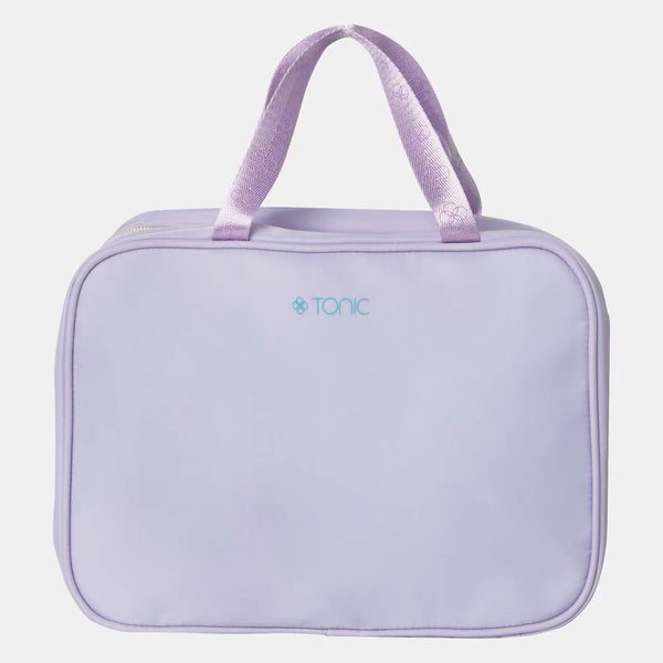 Lavender toiletry bag with handle on a light purple background
