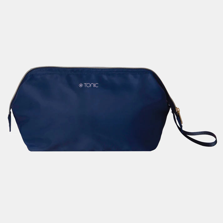 Navy blue pouch with 'Tonic' branding on a light gray background
